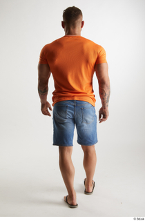 Garrott  1 back view blue jeans shorts dressed flip…